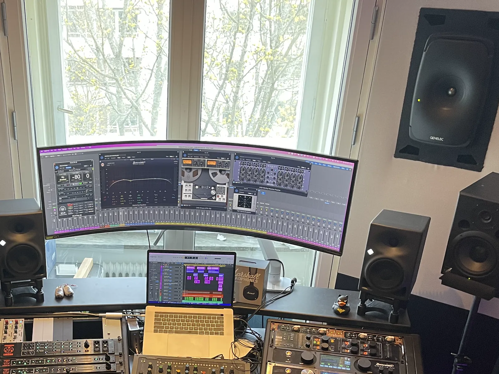 The custom mastering workstation between Genelec 8351B monitors